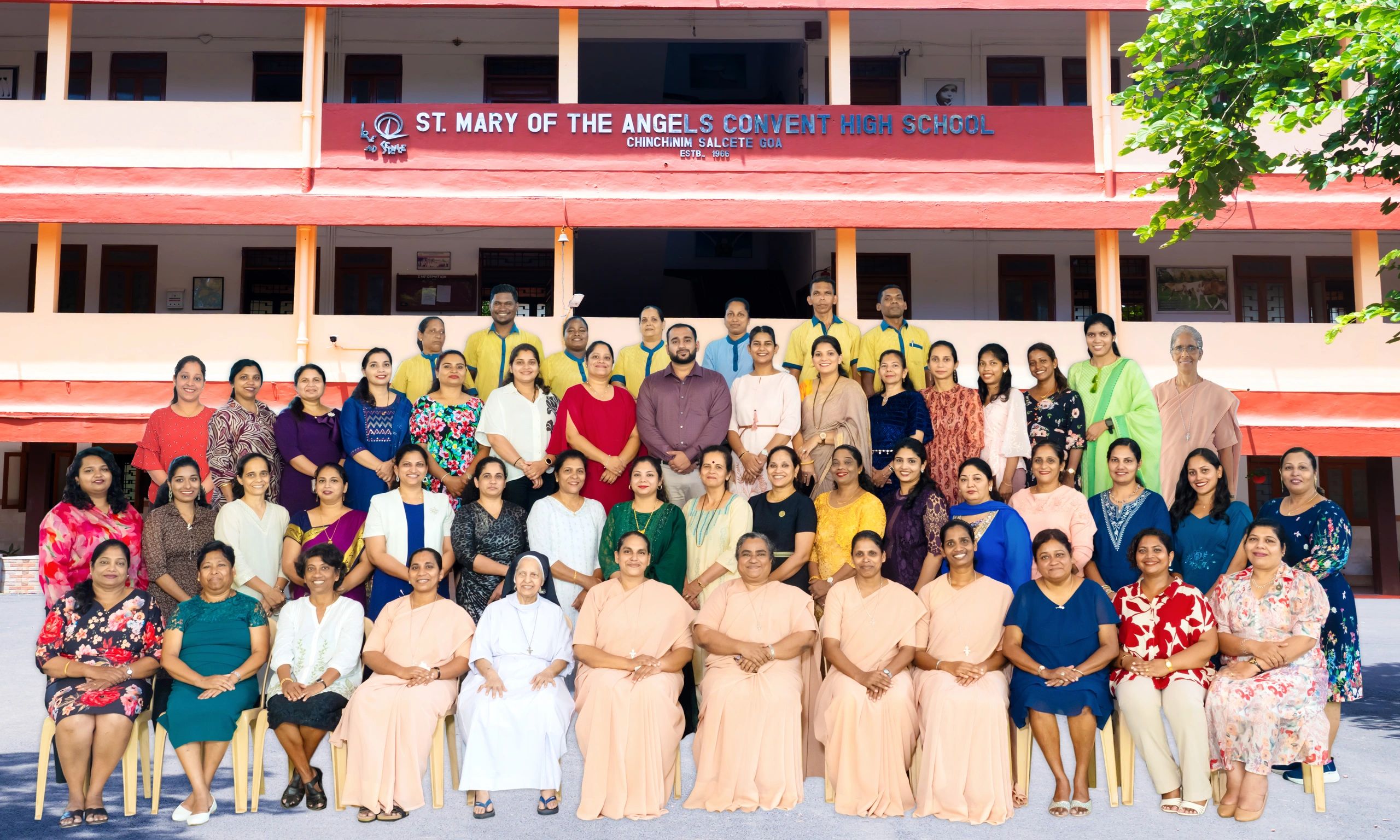 Group photo of staff at St. Mary of the Angels Convent High School.