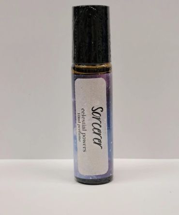 Small roller bottle labeled "Sorcerer celestial powers" with purple design.