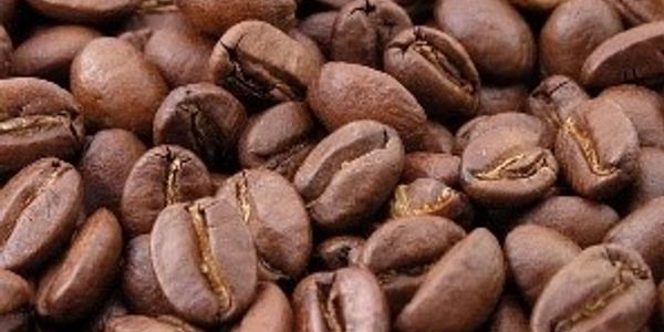 Close-up of roasted coffee beans with rich brown tones.