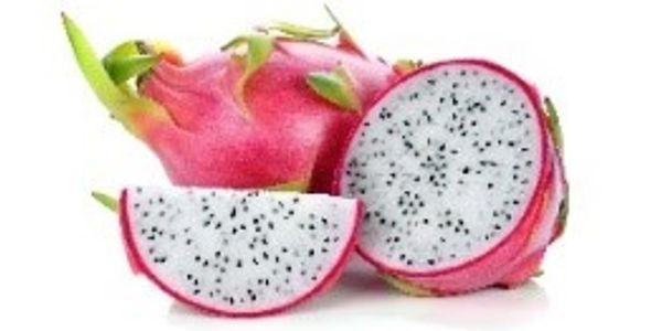Sliced dragon fruit showing its white flesh with black seeds.