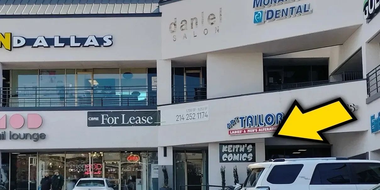 picture of store's outside sign with a big arrow pointing towards it.