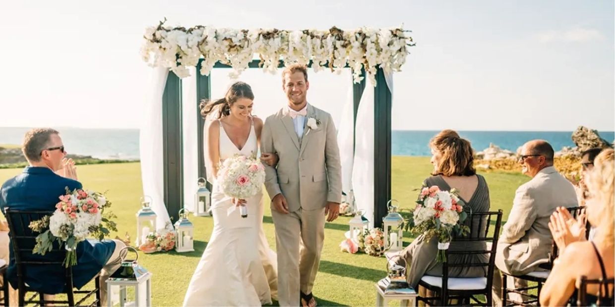 a couple walking down the aisle 