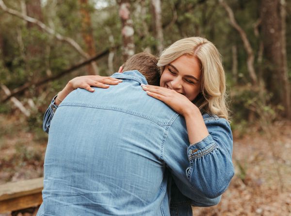man and woman hugging after proposal 