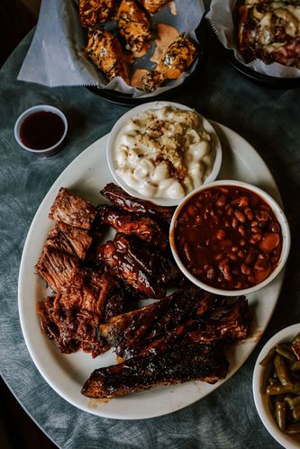 Our delicious in house smoked meats and specialty sides sampler platter. Included: brisket, pork, wi