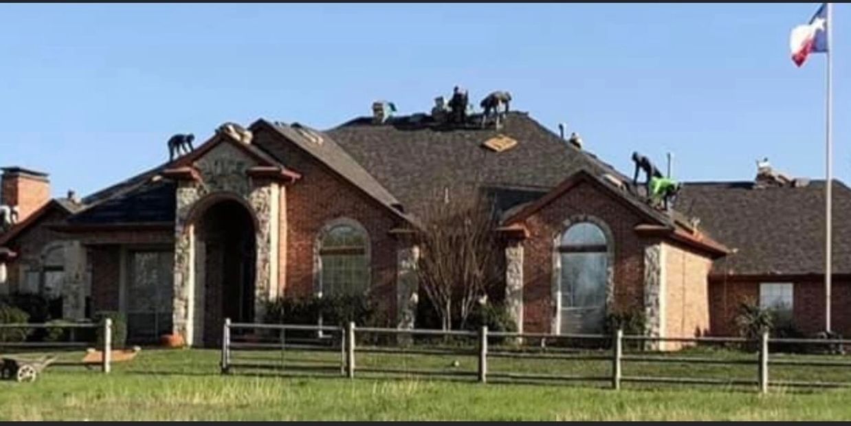 Roofers replacing to roof on one of Mason Roofing's customer's home.