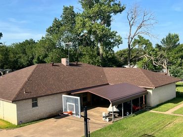 Composition shingle roof with attached metal carport installed in Burleson, Tx.  by Mason Roofing 