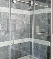 Crescent Series sliding glass shower door.