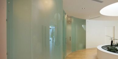 Curved glass partitions with frosted side