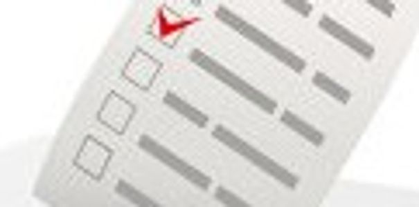 Ballot with a checkmark being dropped into a ballot box