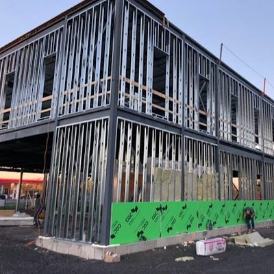Steel frame structure of a two-story building under construction.