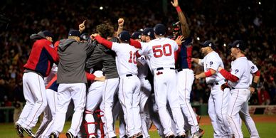 The Boston Red Sox slug their way to the title, setting records for runs scored and all slash line c