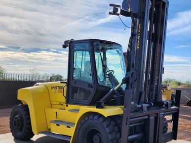 Yellow Hyster 360 forklift parked outdoors.