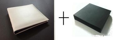 A folded white fabric or cloth and a black box side by side with a plus sign.