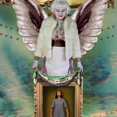 A woman with wings and a Votes for Women banner stands over another woman in a frame.