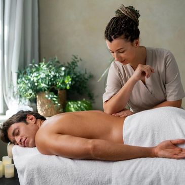 Man enjoying a relaxing massage in a calm, cozy room.