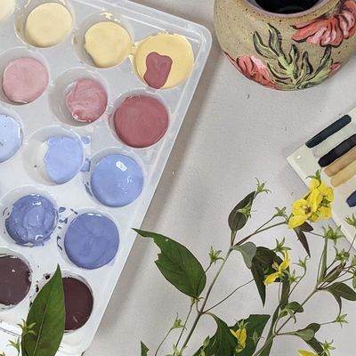 An image of pots painted with underglaze