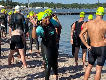 Triathlete smiling and ready for her race about to start