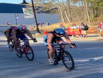 UNC triathlete leading her draft legal bike pack up the hill