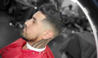 a man getting a stylish haircut 