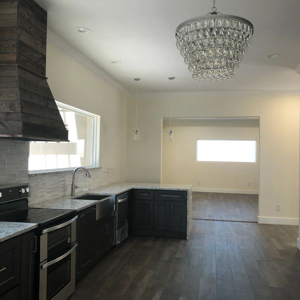 PT Building Supply provided countertops, flooring, and cabinets for this resdential spec house 