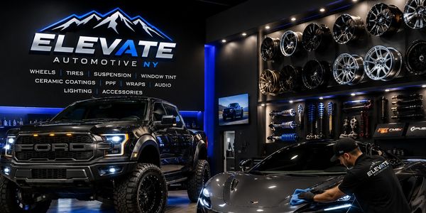 Elevate Automotive NY showroom with vehicles and wheels.