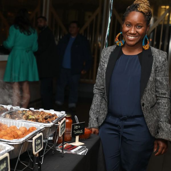 Woman standing next to Homemade in DC catered food