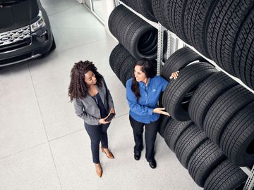 Tire expert helping customer select the right tire