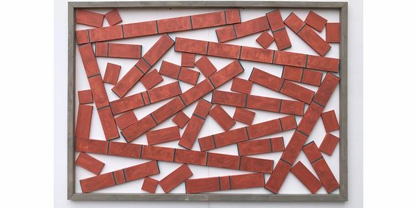 Red bricks randomly arranged inside a gray frame.