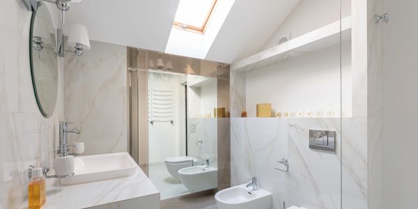 A bathroom with white marble