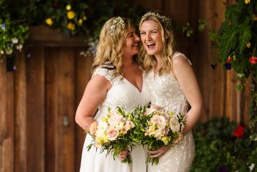 Two brides looking very happy