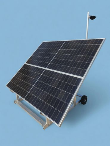 Mobile solar panel system with wheels and a light on a pole.