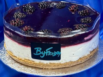 A blackberry cheesecake with a blueberry glaze.