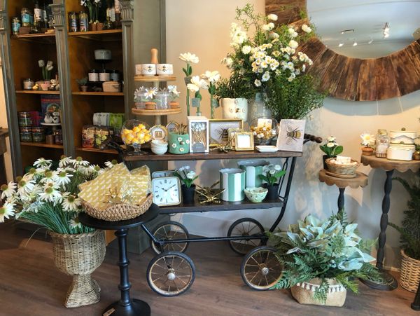 Decorative floral and home decor display with a rustic theme.