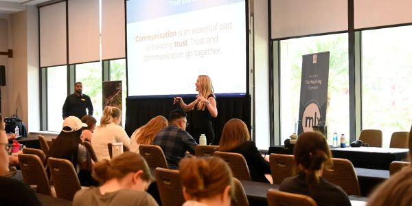 Participants in a facilitated workshop discussing trust and communication.