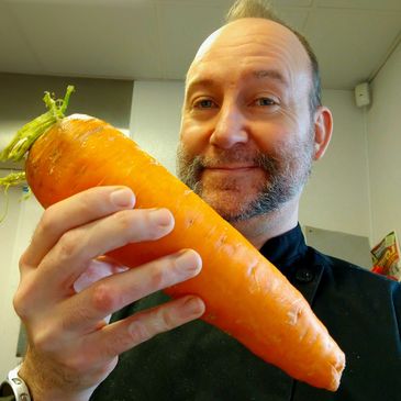 Chef Matt admiring a giant carrot