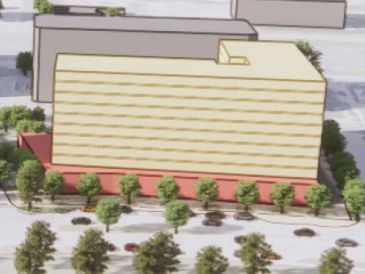 Architectural model of a rectangular building surrounded by trees.