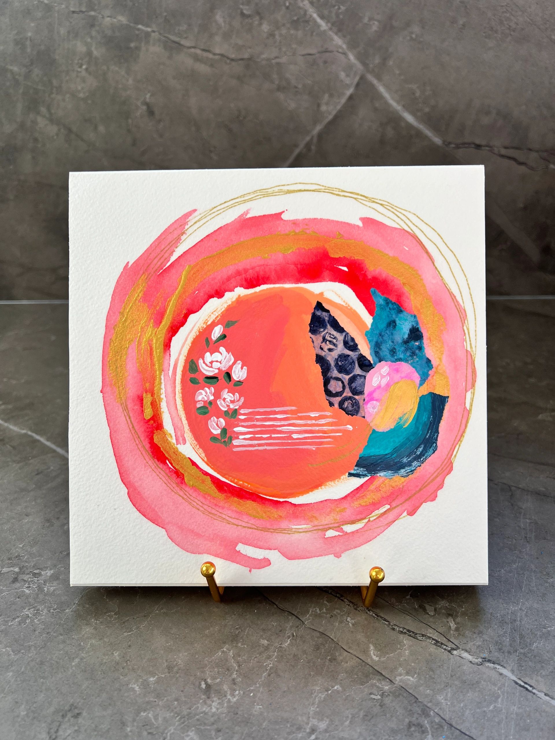Abstract circular watercolor painting with floral and geometric patterns in vibrant colors.