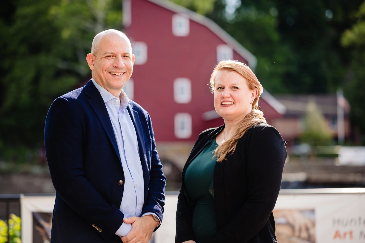Jason Blazakis and Caitlin Giles-McCormick in front of the Red Mill in Clinton
