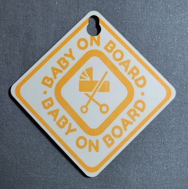 Baby on board sign with stroller icon.