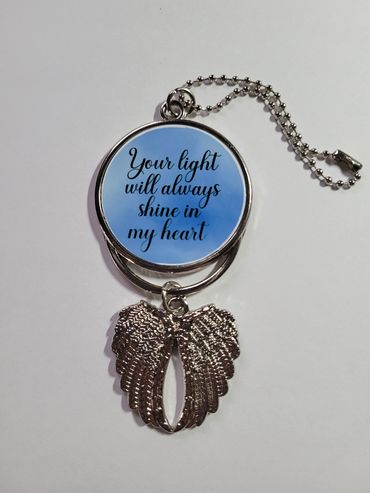 Keychain with angel wings and heartfelt message.