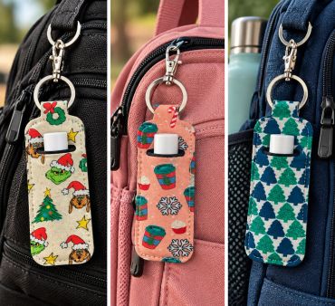 Three festive hand sanitizer holders attached to backpacks.