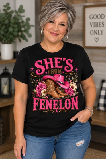 Woman wearing a black shirt with colorful text and graphics.