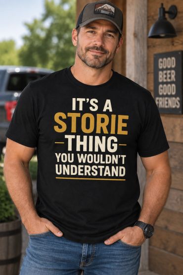 Man wearing a black t-shirt with a message about Storie.