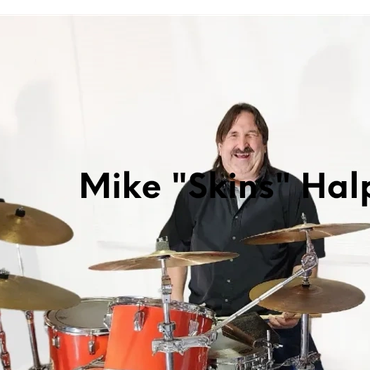 Man playing drums with smile