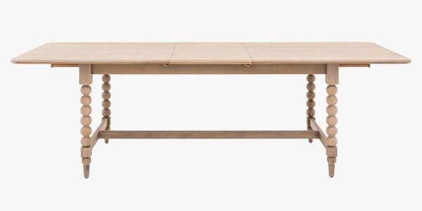 The Spindler Extendable Dining Table brings classic craftsmanship into a modern classic home