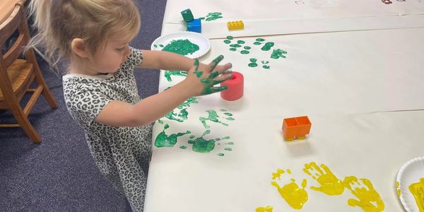 small child finger painting