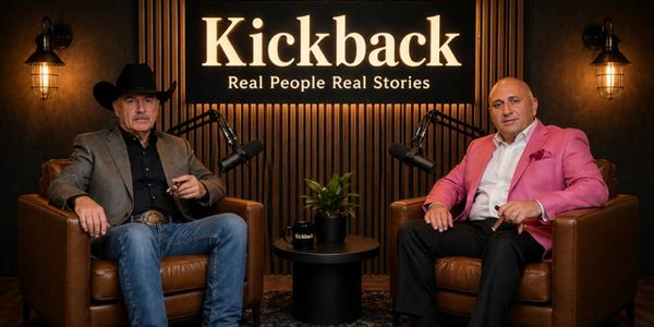 Two men seated in a podcast studio with 'Kickback' sign behind them.