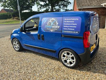 Blue Chase Worx service van parked on gravel.