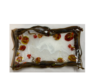 Rectangular glass tray with autumn-themed decorations and dark brown twisted edges.