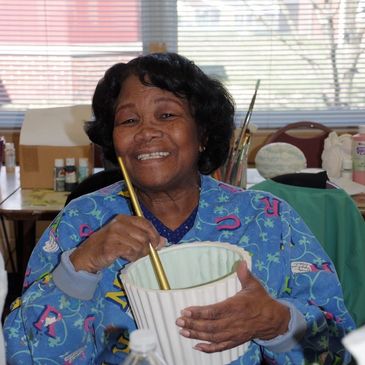 Senior citizen creating a ceramic masterpiece!